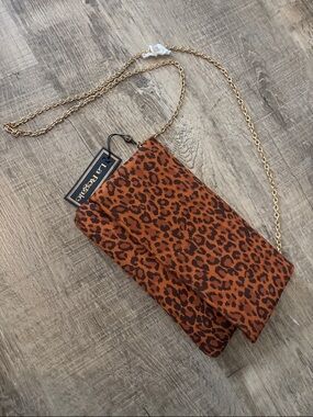 La Regale Gold Chain Leopard Crossbody in Rust and Black